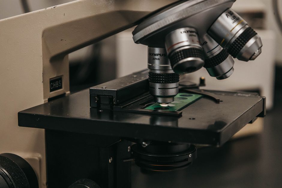 Detailed view of a laboratory microscope, essential for scientific research and analysis.
