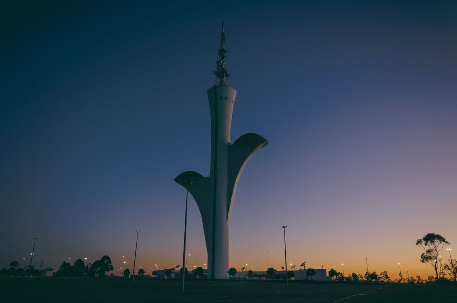 Stunning view of the Brasilia Digital TV Tower during a dramatic sunset in Brasília, Brazil.