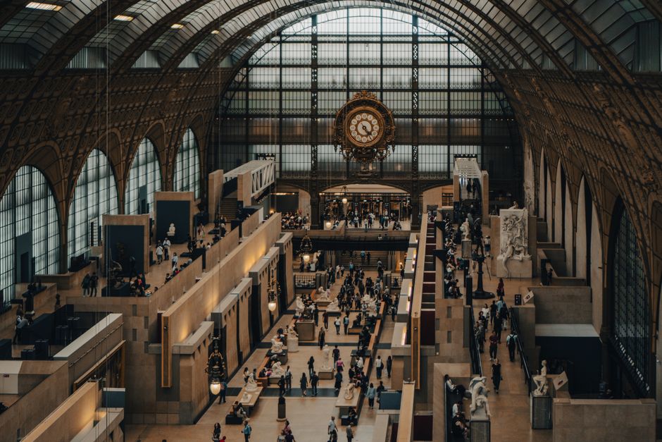 A bustling interior of the iconic Musée d'Orsay in Paris, France.