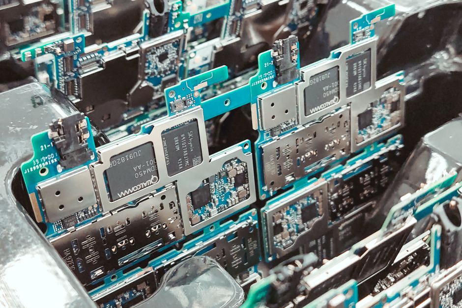Close-up of intricate circuit boards in a Vietnamese factory, capturing modern electronics production.
