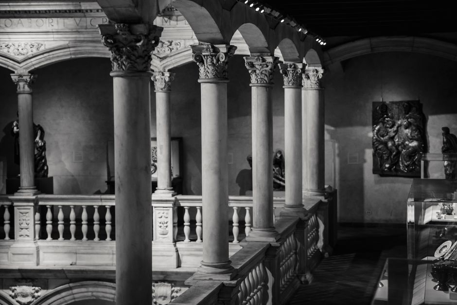 Black and white classic interior design of majestic mansion hallway with pillars and ornamental stucco elements