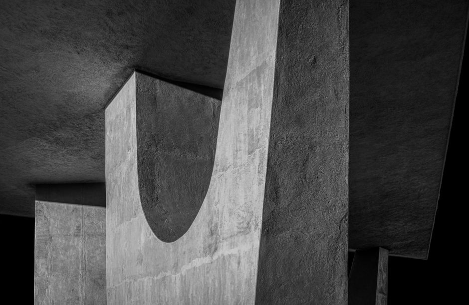 A striking black and white image of modern concrete architecture showcasing texture and design.